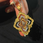 Rotating Four - Leaf Clover Necklace – Dual - Tone Gold & Silver with Pave Diamonds - floysun