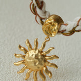 Sunrise Bloom Necklace – Woven Cord & Hammered Gold Sun Pendant - floysun