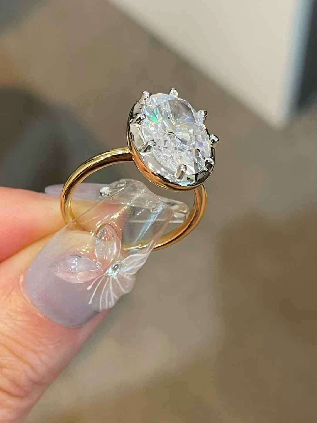 Oversized oval diamond simulant solitaire ring in 18K gold vermeil and sterling silver