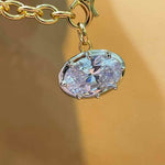 Oval diamond simulant pendant in 18K gold vermeil and sterling silver; pendant only