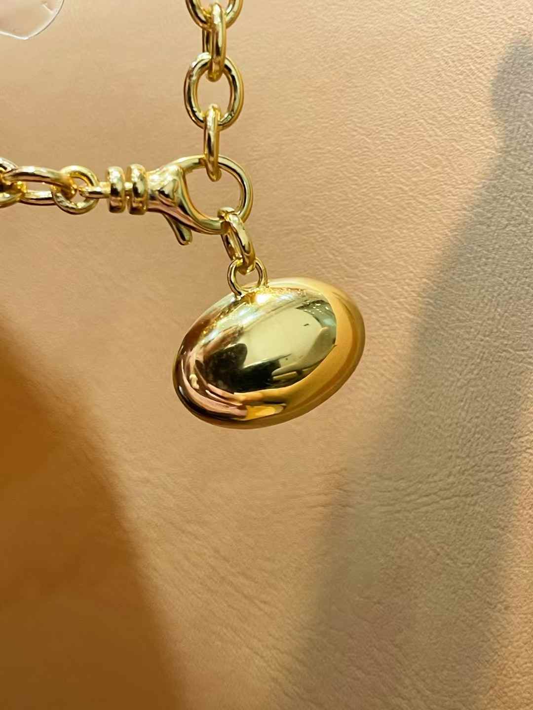 Oval diamond simulant pendant in 18K gold vermeil and sterling silver; pendant only