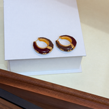 Burgundy enamel hoop earrings - angled pair view