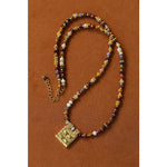 Multicolor stone necklace with textured gold square pendant