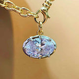 Oval diamond simulant pendant in 18K gold vermeil and sterling silver; pendant only