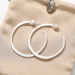 Sculptural white C-hoop statement earrings in 925 sterling silver
