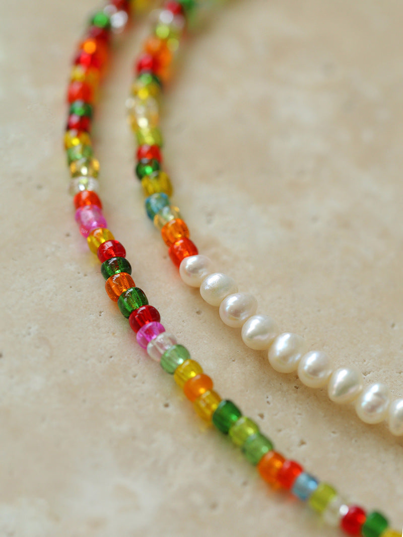 Close-up of multicoloured glass beads and freshwater pearl transition