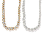 Gold and silver graduated CZ necklaces shown together