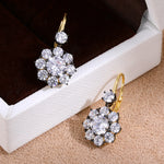 Black-and-Gold Floral Halo Cubic Zirconia Earrings - alternate angle | Floysun