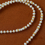 Freshwater pearl beads with gold-tone spacers