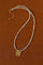 Freshwater pearl pendant necklace laid flat