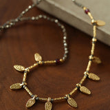 Vintage Leaf Multi‑Charm Pyrite Hand‑Strung Necklace
