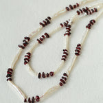 Toothpick and mini pearl necklace styles displayed together