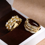 Two cubic zirconia ribbon ring styles in jewelry box