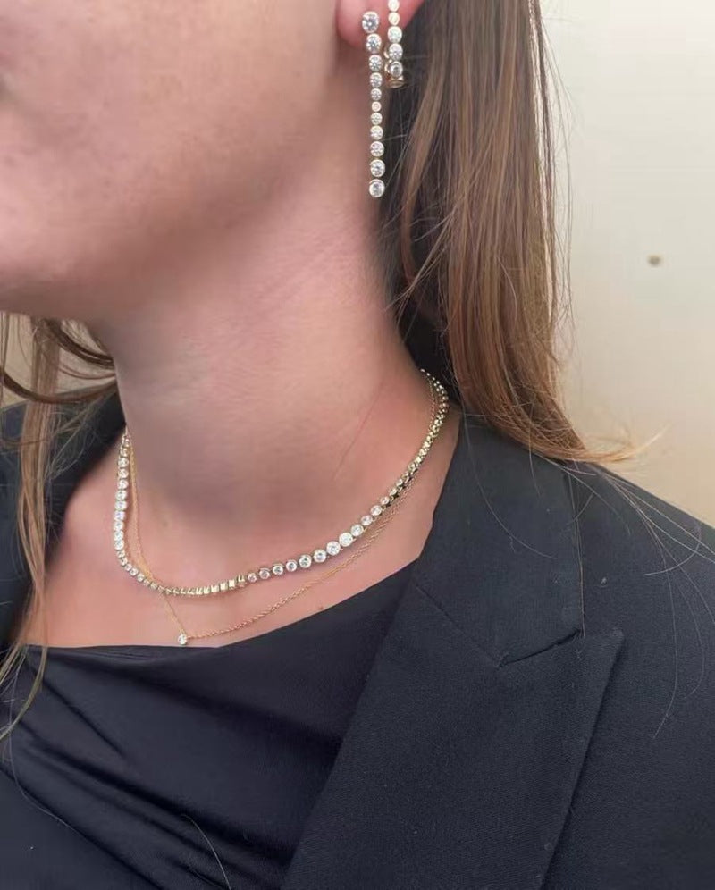 CZ tennis necklace styled with a dark top