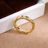 Sculpted ribbon wrap band ring - front view