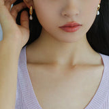 Effortlessly Stylish: Asymmetrical Metal and Pearl Earrings