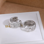 Silver brushed floral cubic zirconia hoop earrings - front pair view