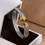 Polished two-tone flexible cuff bracelet in jewelry box