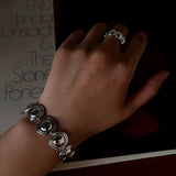 Silver oval dome bracelet styled with a ring