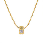 Gold brushed floral cubic zirconia pendant necklace on white background