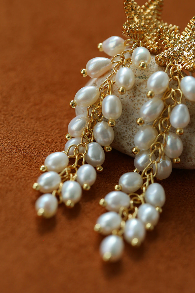 Close-up of freshwater pearl strands beneath a starfish stud