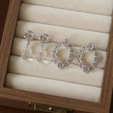 Morning Dew Clear Quartz Drop Earrings - Floral Studs with Purple Zirconia