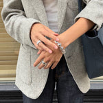Oval dome link bracelet styled with a grey jacket