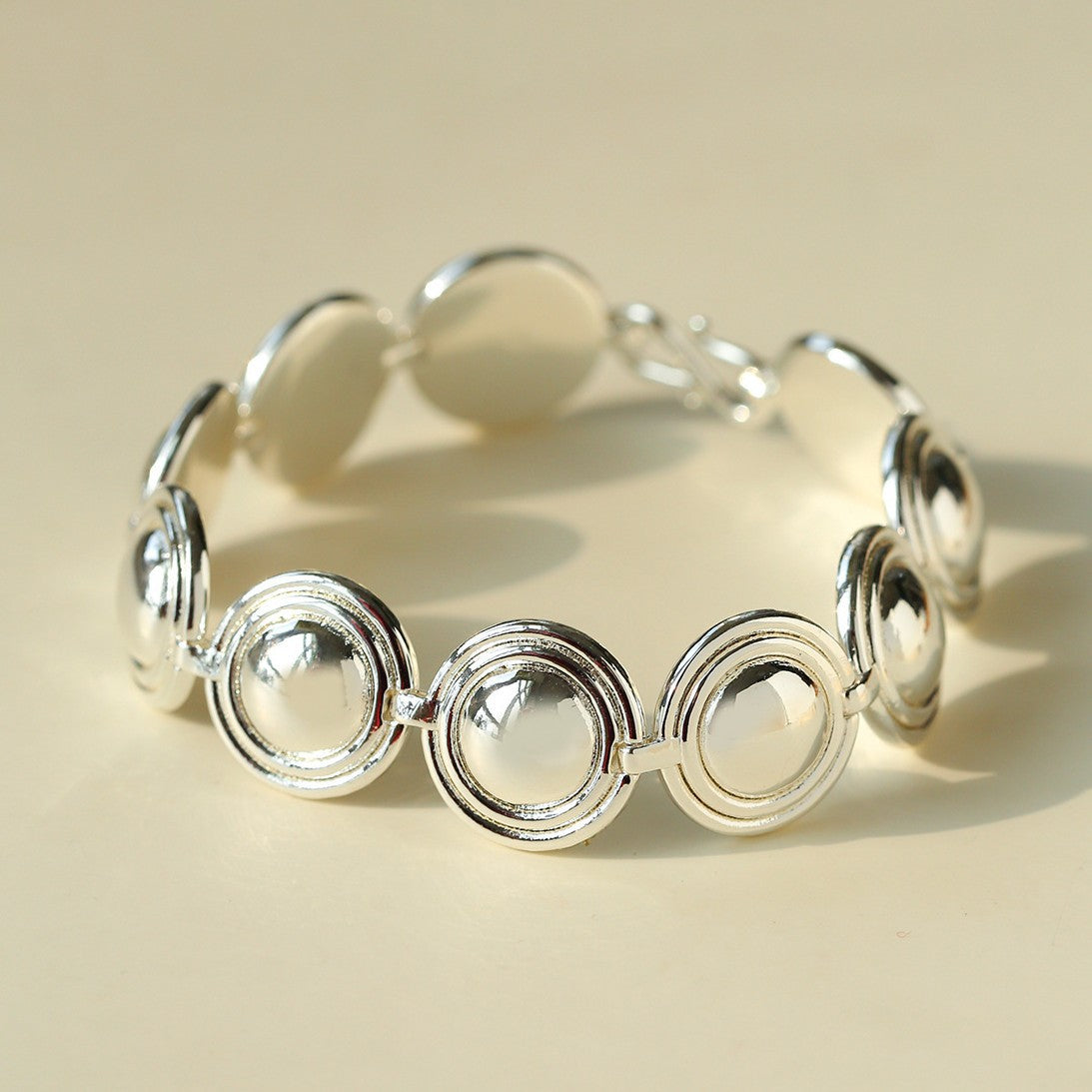 Close-up of silver oval dome bracelet links
