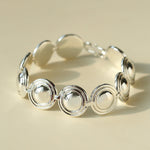 Close-up of silver oval dome bracelet links