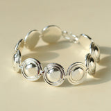 Close-up of silver oval dome bracelet links