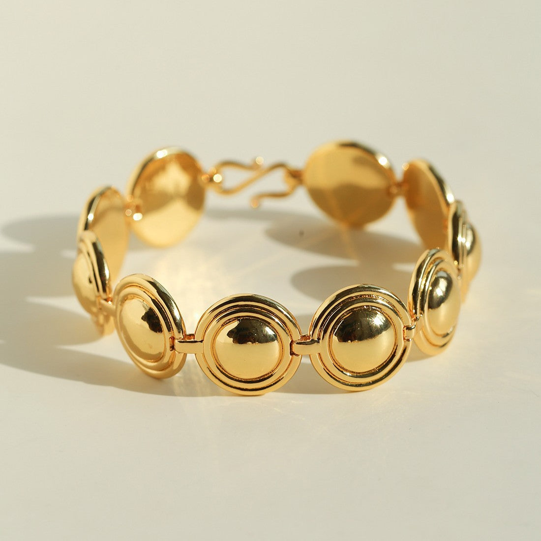 Close-up of gold oval dome bracelet links