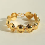 Close-up of gold oval dome bracelet links