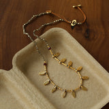 Vintage Leaf Multi‑Charm Pyrite Hand‑Strung Necklace