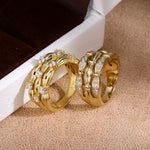 Pavé and scattered cubic zirconia ribbon rings - side view