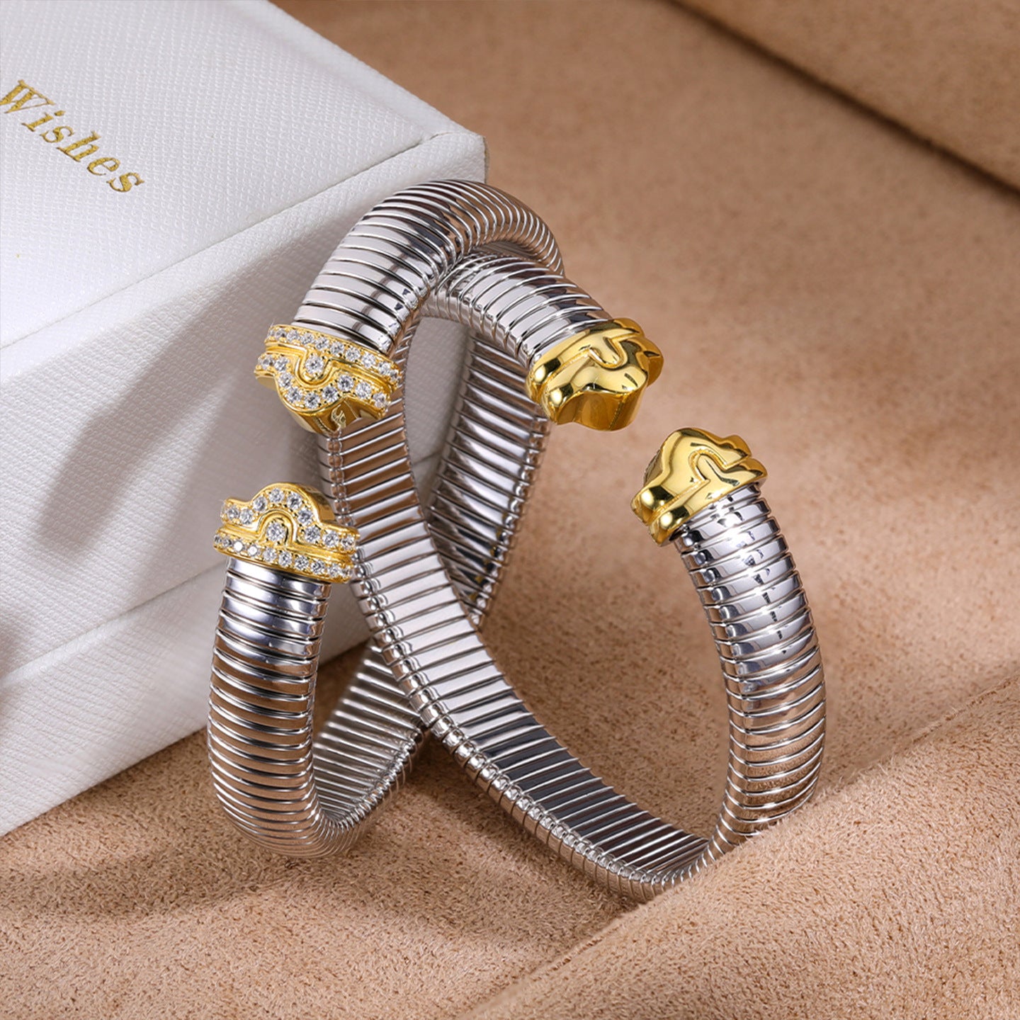 Two-tone sculpted-end cuff bracelets - side view