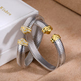 Two-tone sculpted-end cuff bracelets - side view