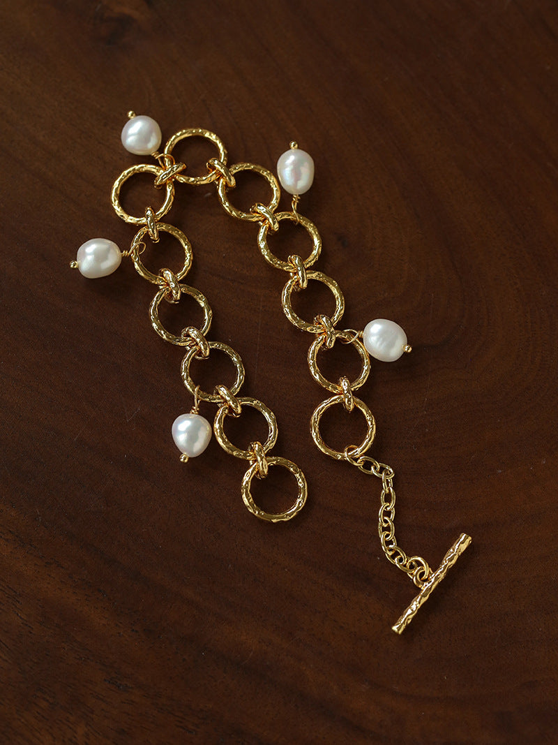 Adjustable gold-tone circle link bracelet with pearl charms
