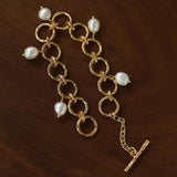 Adjustable gold-tone circle link bracelet with pearl charms