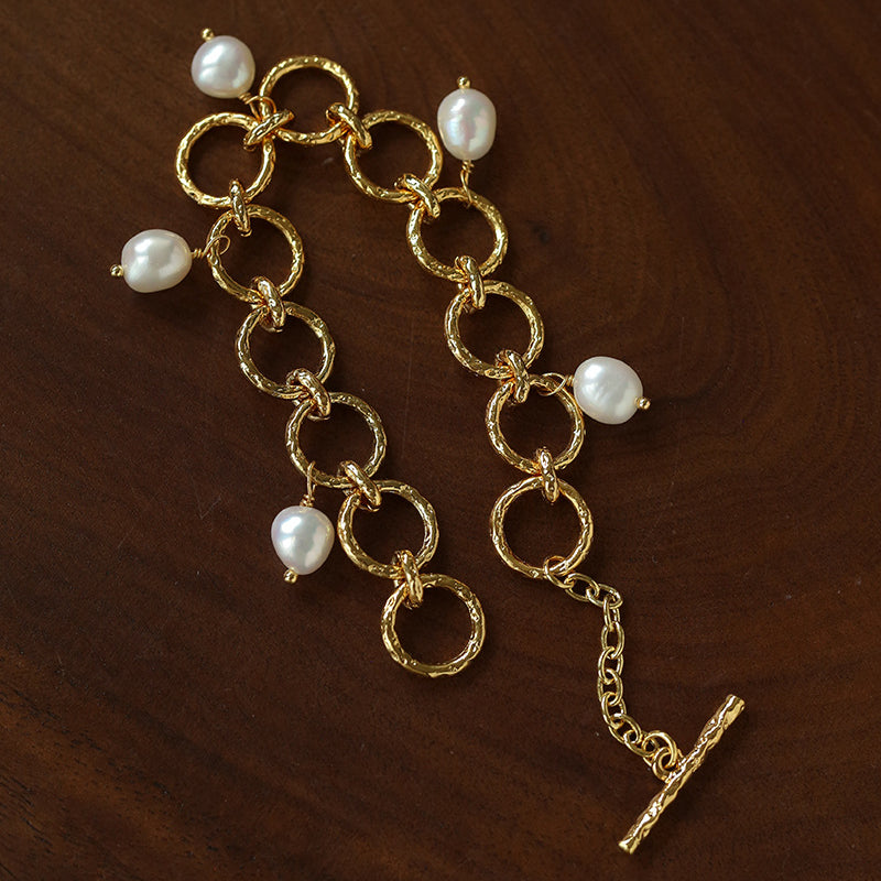 Adjustable gold-tone circle link bracelet with pearl charms