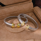 Polished and pavé two-tone flexible cuff bracelets