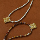 Pearl and natural stone necklace styles on a brown background