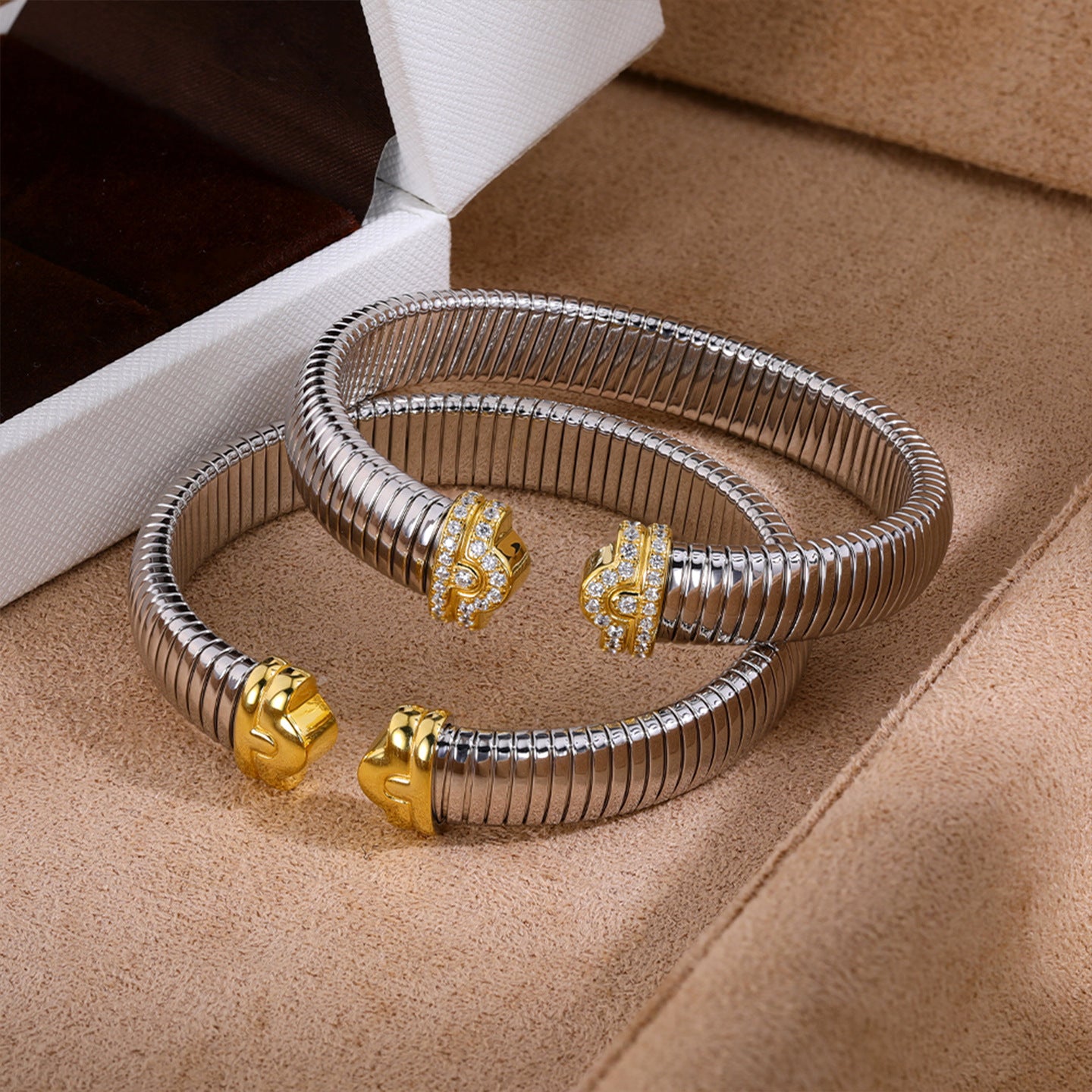 Flexible silver cuff bracelets with gold sculpted ends