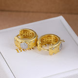 Gold brushed floral cubic zirconia hoop earrings - front pair view