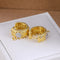 Gold brushed floral cubic zirconia hoop earrings - front pair view