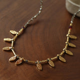 Vintage Leaf Multi‑Charm Pyrite Hand‑Strung Necklace
