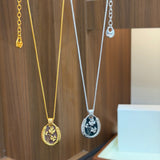 Gold and silver four-leaf clover pendant necklaces - front view