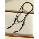 Collier long céleste en agate noire et œil de tigre