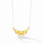 Gold ruffle pendant with silver-tone chain