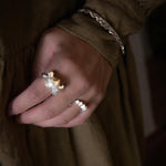 Sculptural ruffle ring styled with other jewellery