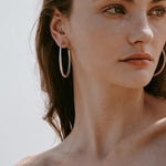Sculptural white C-hoop statement earrings in 925 sterling silver